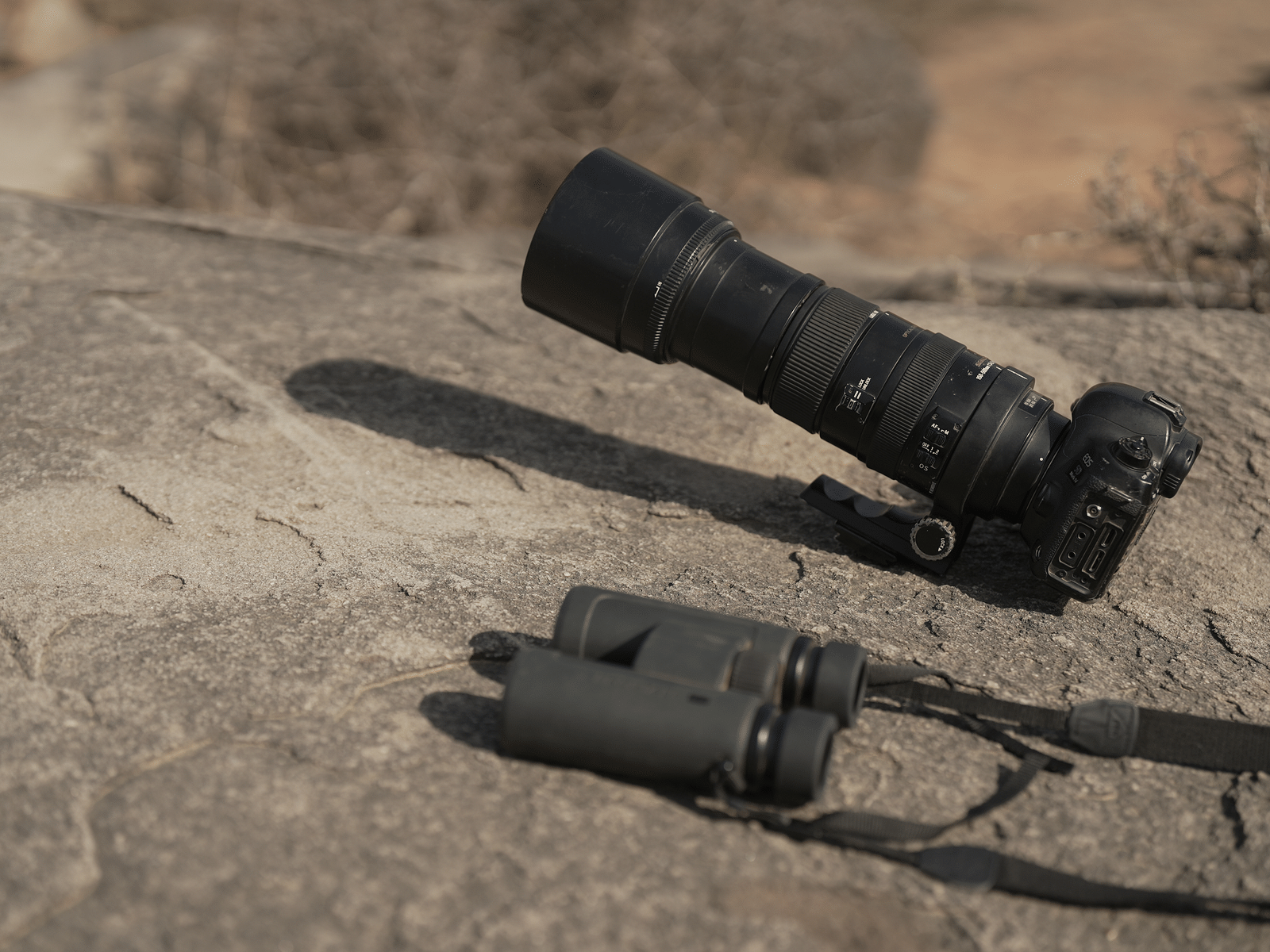 Essential Photography Gear kept on a rock | Utsav Camp